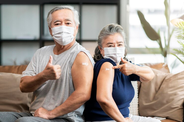 old-asian-senior-couple-wearing-face-mask-virus-protection-happiness-cheerful-show-bandage-injection-covid19-vaccinated-with-hand-gesture-point-confident-virus-protection_609648-468 ”วัคซีนป้องกันโรคปอดอักเสบ“ ดูแลและใส่ใจวัยเก๋าสูงอายุ 👵👴